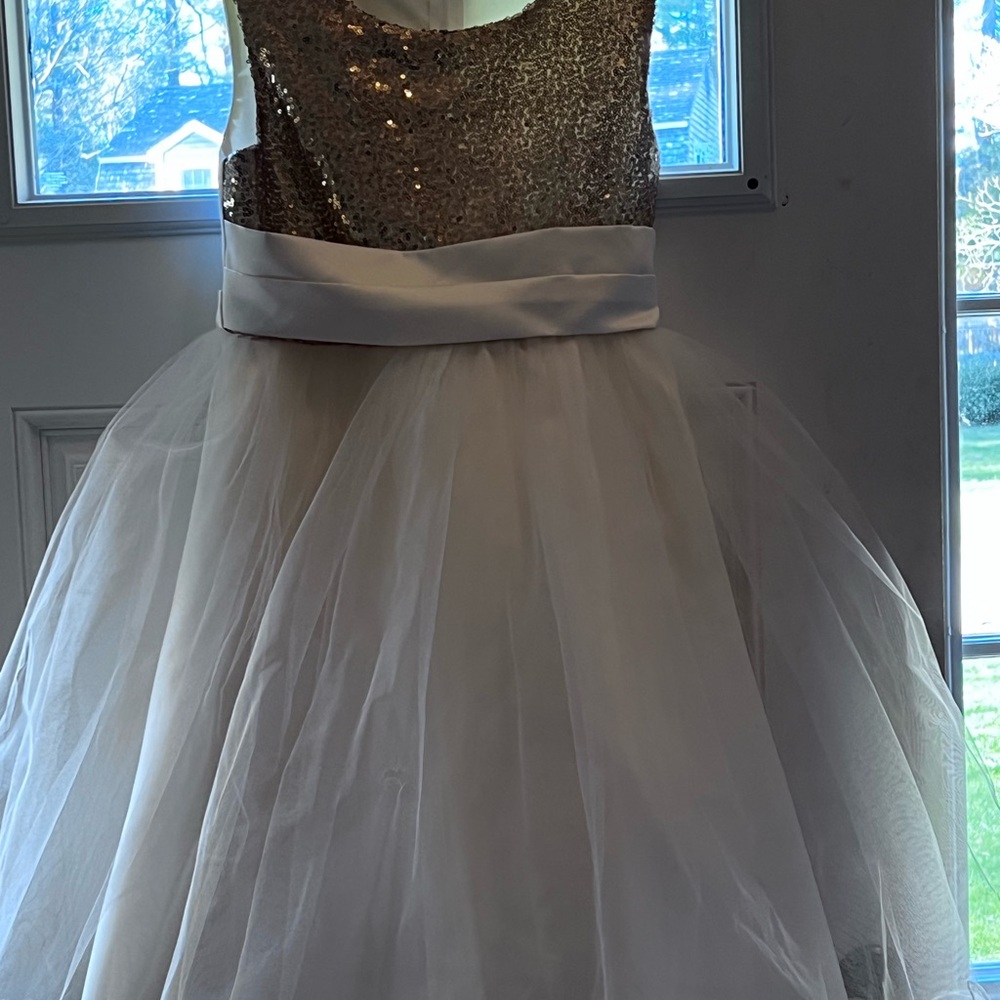 Girls size 12 gold sequences and ivory dress, used once good condition.